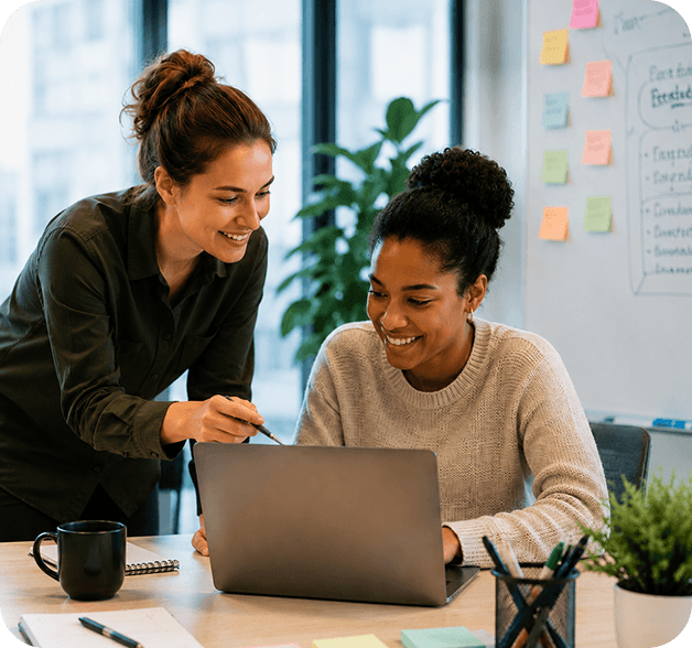 Two people collaborating at a laptop